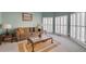 Living room with bay window, plantation shutters, and carpet at 1556 Delford Se Way, Smyrna, GA 30082