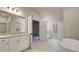 Bathroom with double vanity, soaking tub and walk in shower at 29 Homesite Cooper E Cv, Fayetteville, GA 30215