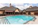 Community pool with surrounding lounge area at 316 Brookhaven Walk # 1404, Johns Creek, GA 30097