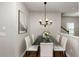 Bright dining area with glass table and chandelier at 8 Elm St, Hampton, GA 30228