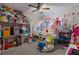Vibrant bedroom with built-in shelves, play area, and plenty of toys and decorations at 4770 Alford Commons, Cumming, GA 30028