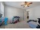 Neutral bedroom with a ceiling fan, gray walls, plush carpet, and closet space at 4770 Alford Commons, Cumming, GA 30028