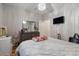 Bright bedroom features a modern chandelier, soft neutral tones, and ample space for relaxation and personalization at 4770 Alford Commons, Cumming, GA 30028