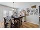 Charming dining area features a stylish table, chairs and unique decorative wall art at 4770 Alford Commons, Cumming, GA 30028