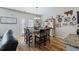 Stylish dining area features a table, chairs, cabinet and decoratively adorned wall at 4770 Alford Commons, Cumming, GA 30028