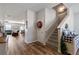 Inviting entryway featuring hardwood floors, staircase, and views into the living spaces at 4770 Alford Commons, Cumming, GA 30028