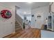 Entryway with hardwood floors, staircase, and views to living and dining areas at 4770 Alford Commons, Cumming, GA 30028