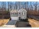 Beautiful two-story home features a gray exterior, attached garage, and a well-maintained front lawn at 4770 Alford Commons, Cumming, GA 30028