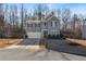 Inviting two-story home with an attached garage and a neatly landscaped front yard at 4770 Alford Commons, Cumming, GA 30028