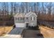 Two-story house with gray siding, a two-car garage, and a partially visible yard at 4770 Alford Commons, Cumming, GA 30028