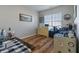 Home office with a desk, chair, and ample natural light from a large window at 4770 Alford Commons, Cumming, GA 30028