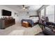 Main bedroom with king-size bed and plenty of natural light at 4770 Alford Commons, Cumming, GA 30028