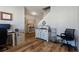 A room being used as an office and storage space with hardwood flooring and white walls at 4770 Alford Commons, Cumming, GA 30028