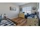 Bright office space with hardwood floors and a large window at 4770 Alford Commons, Cumming, GA 30028