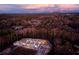 Aerial view of new construction homes nestled in a serene wooded community at 907 E Green Ln, Clarkston, GA 30021