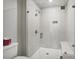 Modern bathroom with glass-enclosed shower, built-in bench, and herringbone tile at 907 E Green Ln, Clarkston, GA 30021