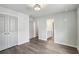 Bedroom featuring hardwood floors, ensuite bathroom and large closets at 907 E Green Ln, Clarkston, GA 30021