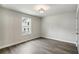 Bright bedroom with hardwood flooring and a double window, offering ample natural light at 907 E Green Ln, Clarkston, GA 30021