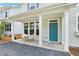 Charming front porch with stylish seating offering a welcoming entrance to this inviting home at 907 E Green Ln, Clarkston, GA 30021