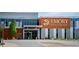 Emory Healthcare medical complex featuring a modern entrance and ample parking at 907 E Green Ln, Clarkston, GA 30021