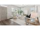 Bright and open living room with large windows, modern furnishings, and a welcoming atmosphere at 907 E Green Ln, Clarkston, GA 30021