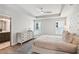 Comfortable main bedroom features a tray ceiling and ensuite bathroom entrance at 907 E Green Ln, Clarkston, GA 30021
