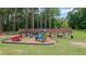 Community playground with various play structures, picnic tables, and shaded area at 907 E Green Ln, Clarkston, GA 30021