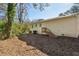 View of back of house and backyard with wooden steps at 3563 Bolfair Nw Dr, Atlanta, GA 30331