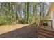 Backyard with wooden deck and access to wooded area at 3563 Bolfair Nw Dr, Atlanta, GA 30331