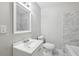 Renovated bathroom with marble tile and a white vanity at 3563 Bolfair Nw Dr, Atlanta, GA 30331