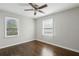 Well-lit bedroom with hardwood floors and two windows at 3563 Bolfair Nw Dr, Atlanta, GA 30331
