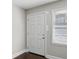 Interior entryway with white door and dark hardwood floors at 3563 Bolfair Nw Dr, Atlanta, GA 30331