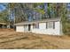 Newly painted one-story house with a manicured lawn at 3563 Bolfair Nw Dr, Atlanta, GA 30331