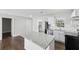 Modern kitchen with white cabinets, granite island, and stainless steel appliances at 3563 Bolfair Nw Dr, Atlanta, GA 30331