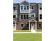 Townhome exterior with stone, neutral siding, and a welcoming front porch at 3790 Jack Vernon Cir, Powder Springs, GA 30127