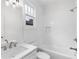 Bathroom with white subway tile and tub at 971 Boulevard # B, Atlanta, GA 30312