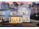 Two-story home with gray siding, front porch, and landscaping at 3827 Cottage Cir, Tucker, GA 30021