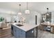 Modern kitchen island with quartz countertop and gray cabinets at 3827 Cottage Cir, Tucker, GA 30021