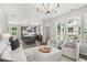 Open living room with kitchen and island, featuring neutral colors at 3827 Cottage Cir, Tucker, GA 30021