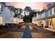 Charming neighborhood street view at sunset with sidewalks and manicured lawns at 3827 Cottage Cir, Tucker, GA 30021