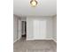 Bedroom featuring neutral walls, plush carpet, and closet at 7018 Chimney Ridge Dr, Riverdale, GA 30296