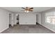 Bedroom with neutral paint, ceiling fan, bright window, and carpeted floors at 7018 Chimney Ridge Dr, Riverdale, GA 30296