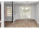 Dining area with wood floors, sliding glass doors, and view to the back yard at 7018 Chimney Ridge Dr, Riverdale, GA 30296