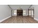Spacious living room with a stone fireplace, large windows, and modern flooring at 7018 Chimney Ridge Dr, Riverdale, GA 30296