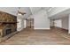 Spacious living room with a vaulted ceiling, stone fireplace, and large windows at 7018 Chimney Ridge Dr, Riverdale, GA 30296