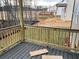 New wood deck overlooks a cleared backyard at 319 Willam Gossett Dr, Canton, GA 30114