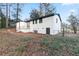 White brick ranch house with backyard and mature trees at 3215 Pennignton Cir, Atlanta, GA 30354