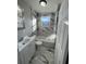 Updated bathroom with marble tile and bathtub at 346 Tazor St, Atlanta, GA 30314