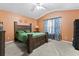 Spacious bedroom with a ceiling fan, large bed, and carpeted floor at 188 Brandon Ridge Cir, Stockbridge, GA 30281