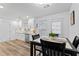 Bright kitchen with white cabinets, stainless steel appliances, and wood flooring at 188 Brandon Ridge Cir, Stockbridge, GA 30281